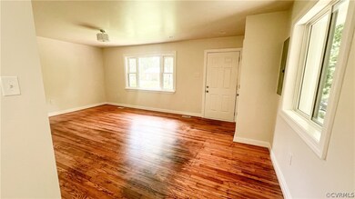 Living room featuring wood-type flooring