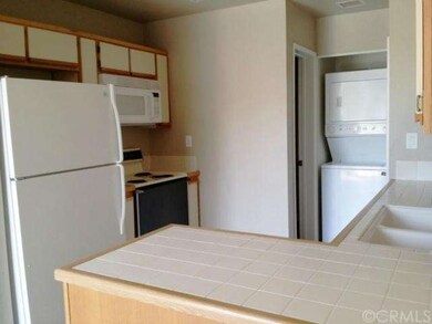Original tile counters and oak framed cabinets.  I