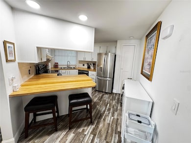 Kitchen with eat in bar area.