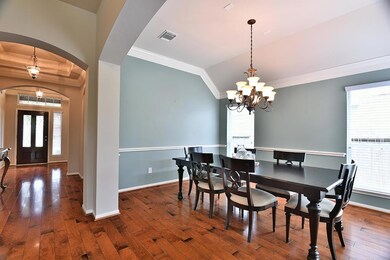 Dining room is behind the study and boasts stunning hardwood floors.
