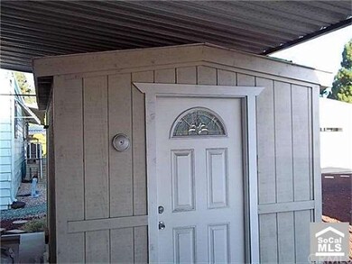 Shed has carpet flooring and stoage cabinets and w