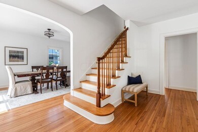 Central Staircase with Refinished Floors