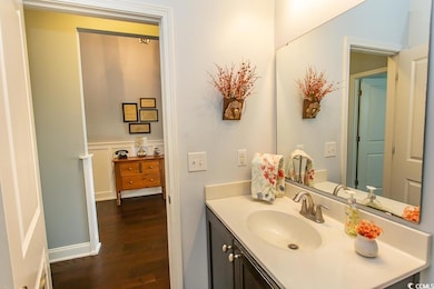 Bathroom featuring hardwood / wood-style floors an