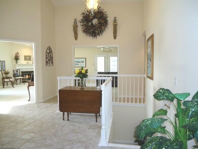 The bright and open foyer features vaulted ceiling