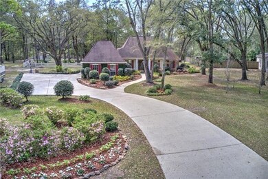 Park like grounds, mature trees, large drive with 