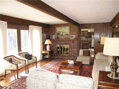 Family Room. Warm and inviting, the beamed family 