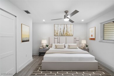 Bedroom with visible vents, baseboards, wood finis