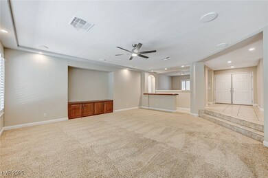 Unfurnished living room featuring carpet, visible