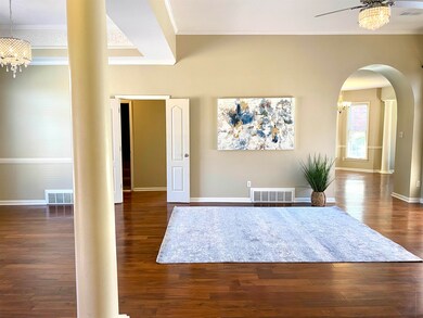Entrance foyer featuring crown molding, ceiling fa