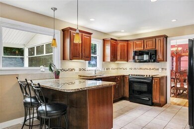 Renovated kitchen with ceramic tile floor, lots of