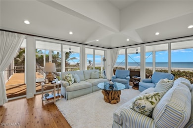 Living room with a wealth of natural light, hardwo