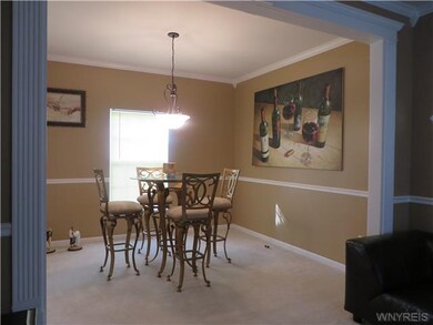 Dining Room. Notice massive fluted trim, chair rai