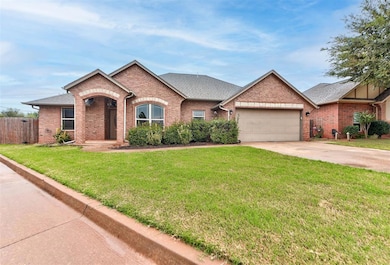 Single story home with roof with shingles, brick siding, concrete driveway, and a garage