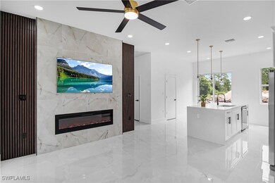 Living room with recessed lighting, a premium fire