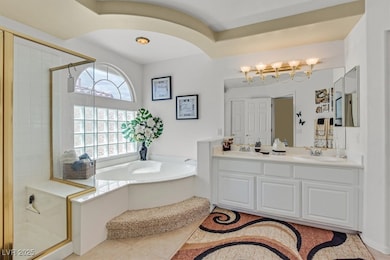 Primary Bathroom featuring a Roman Tub, Seperate W
