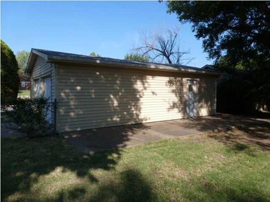 Garage has a small patio area on the East side so 