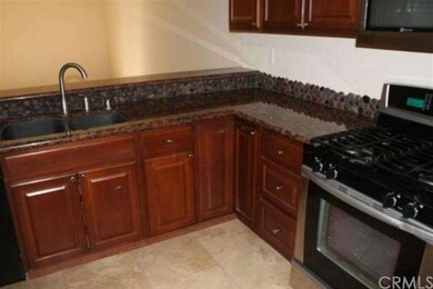 Granite counters with stone backsplash.