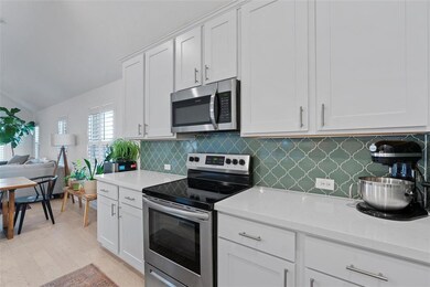 Kitchen with stainless steel appliances, light co