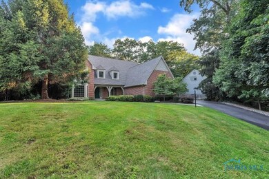 Beautiful brick High Oaks house on the hill.