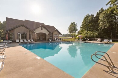 Community pool with a patio