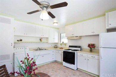 Large bright kitchen with fan