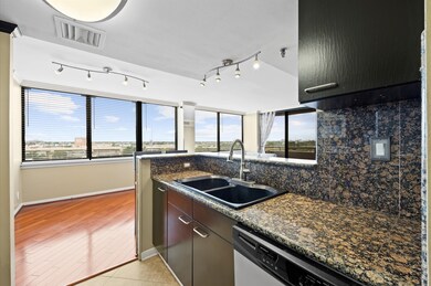 The kitchen features granite countertops, stainles