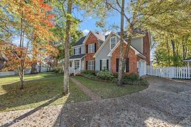 Traditional-style house with concrete driveway and brick​​‌​​​​‌​​‌‌​​‌​​​‌‌​​​​​​‌‌‌​​‌​​‌‌​​​‌ siding
