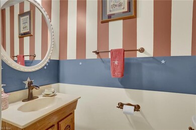 Half bath off the foyer in a private area.