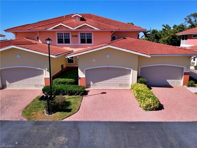 Mediterranean / spanish-style home with a tiled roof, decorative driveway, stucco siding, and an attached garage