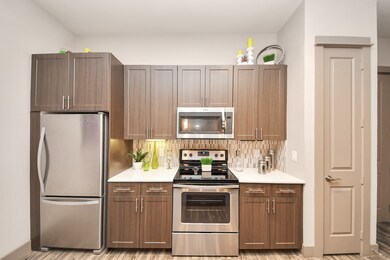 Photos are not of actual units, similar floor plan finishes, verify dimensions