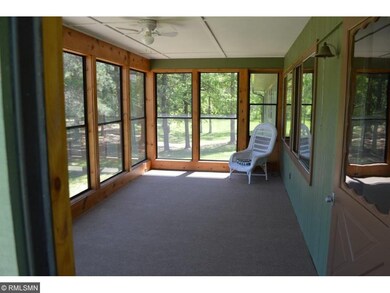 Large 3-season porch with stairs going outside.