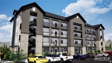 View of apartment building / complex featuring uncovered parking