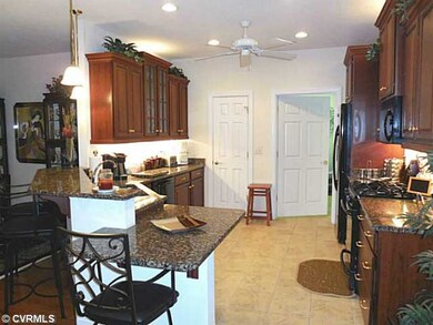 Kitchen - Granite.  CHERRY cabinets.