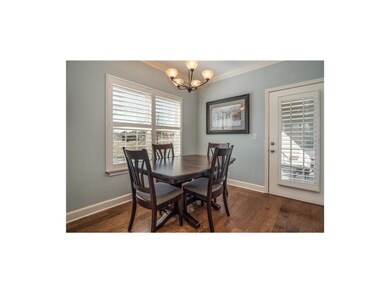 Roomy dining room is bright and airy and overlooks