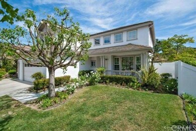 Lush landscaping and newer vinyl fencing