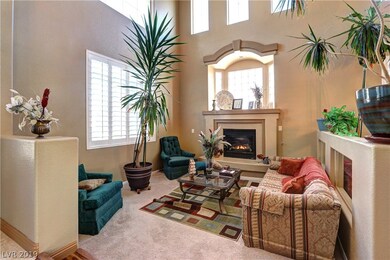 Cozy sunken living room with an inviting gas firep