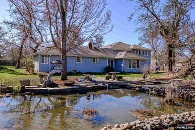 Huge Koi pond in front with waterfall, filtration, and some of the biggest Koi you will ever see.