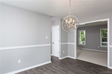 Formal dining room open to living room.