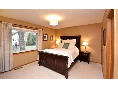 Master bedroom features an updated light fixture a