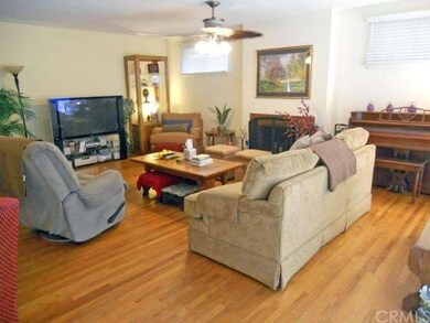 Living room with fireplace and original hardwood f