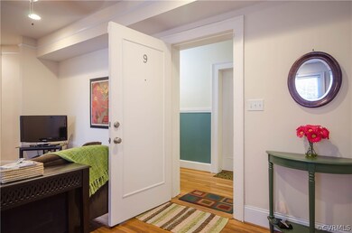 Step in to the welcoming LIVING ROOM with hardwood floors and recessed lighting.