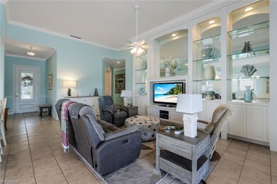 Tiled living room with ornamental molding and ceil
