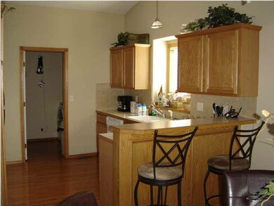 Open kitchen with eating bar.