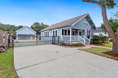Automated gate leads to oversized driveway and gar