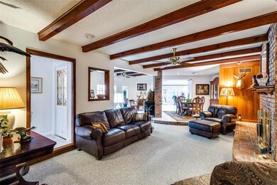 2nd living area features a coffered ceiling.