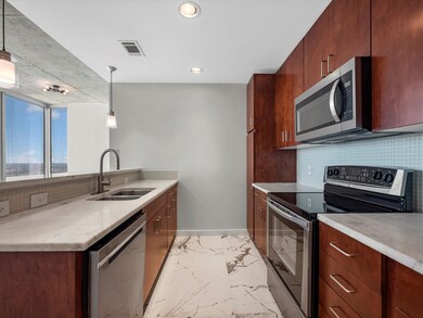 Abundant cabinetry, an upgraded faucet fixture, an