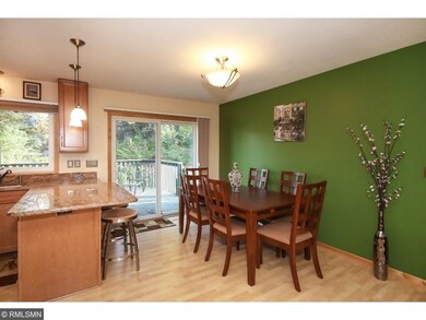 Informal dining area with sliding glass door out t