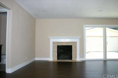 Living room with custom fireplace. Lots of natural