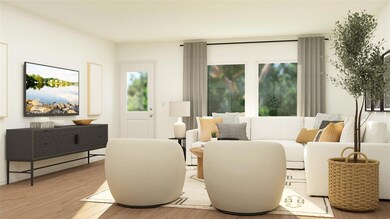 Living area with light hardwood / wood-style floor