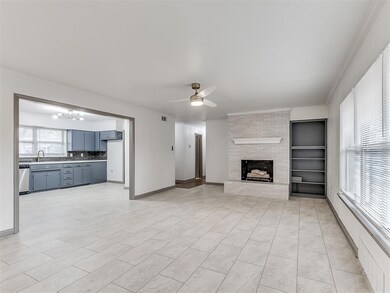 Unfurnished living room with sink, crown molding, 